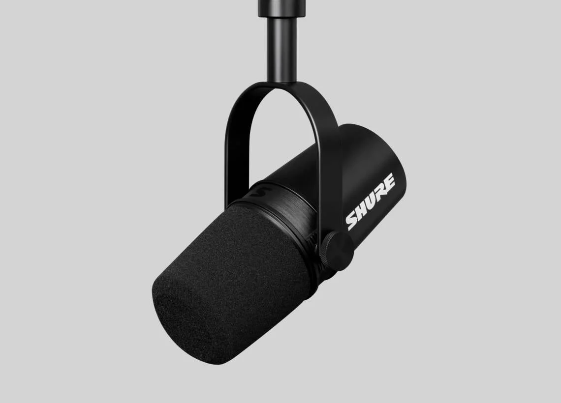Shure MV7X with foam windscreen and adjustable yoke, shown on a separate mounting arm